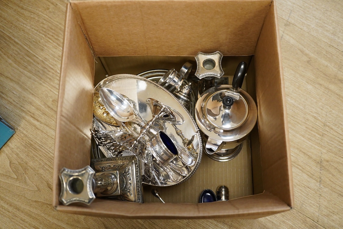 Assorted plated wares including a pair of candlesticks and a casserole dish.